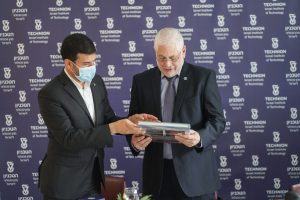 President of the Mohammed VI Polytechnic University in Morocco Mr. Hicham El Habti presents a gift to the President of the Technion Prof. Uri Sivan