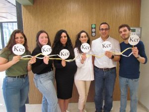 The authors of the article hold a double-stranded DNA-molecule containing histones with crotonyl (Kcr) modification on them, in a routine state where gene expression is possible (marked with a green light). R-L: Feras Machour, Prof. Nabieh Ayoub, Enas Abu Zhahyia, Bella Ben-Oz, Alma Barisaac and Laila Bishara