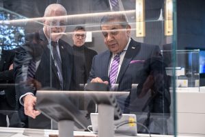 Lord Ahmad (right), Prof. Hossam Haick (back), and Technion President Prof. Uri Sivan at the David and Janet Polak Visitors Center