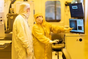 Prof. Meir Orenstein examining the unique oxidation process in the clean room in the MNFU