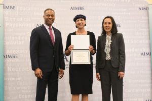 Prof. Shulamit Levenberg receiving the AIMBE fellowship from the hands of AIMBE College of Fellows Chair Prof. Guillermo Ameer and AIMBE President Prof. Joyce Wong.