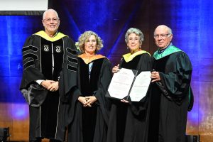 Technion President Uri Sivan and Executive VP for Academic Affairs Prof. Naama Brenner (second from left) conferring the degree on Dr. Martin and Grace Rosman