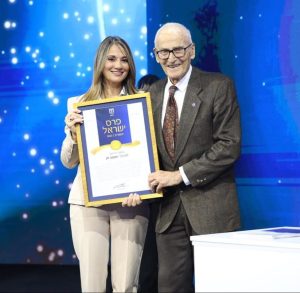 2022 Israel Prize ceremony - former Minister of Education Dr. Yifat Shasha-Biton presenting the Israel Prize to the late Professor Joshua Zak. Photographer: Oded Karni / Courtesy