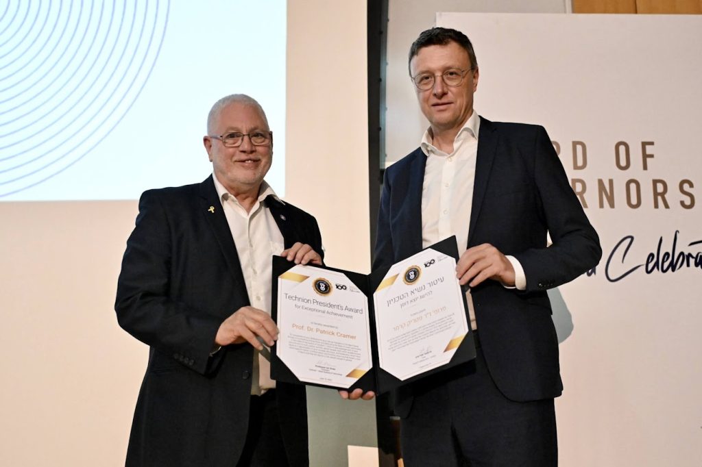 Technion President Prof. Uri Sivan presenting the award to Prof. Dr. Patrick Cramer
