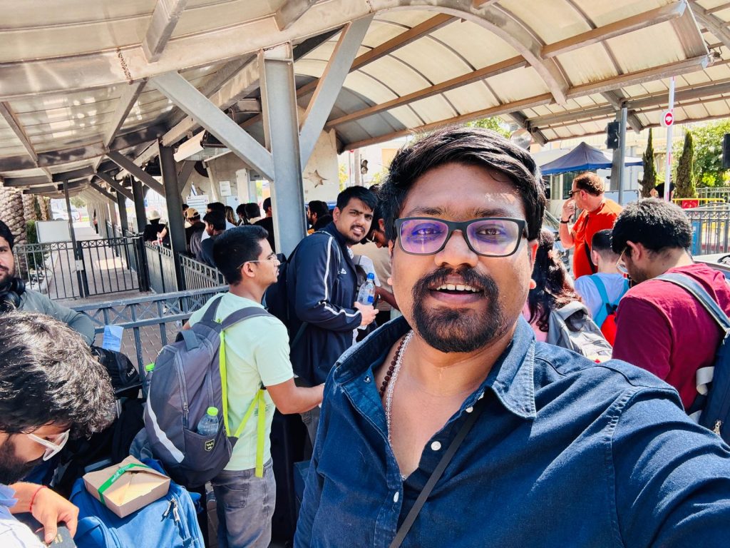 Mohit helping Indian students at the Jordan River Border Crossing