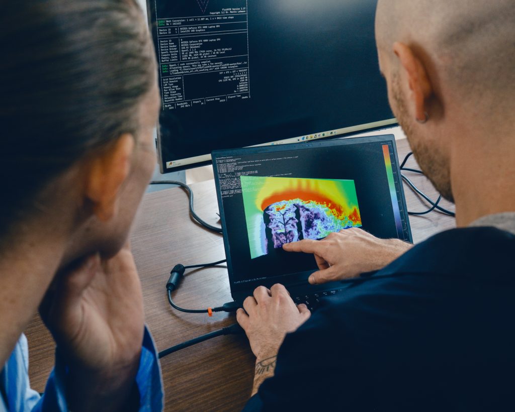 Researchers at the Technion’s Center for Advanced Manufacturing working on a computer simulation of airflow around the sapling; the data is used to design the printing geometry.